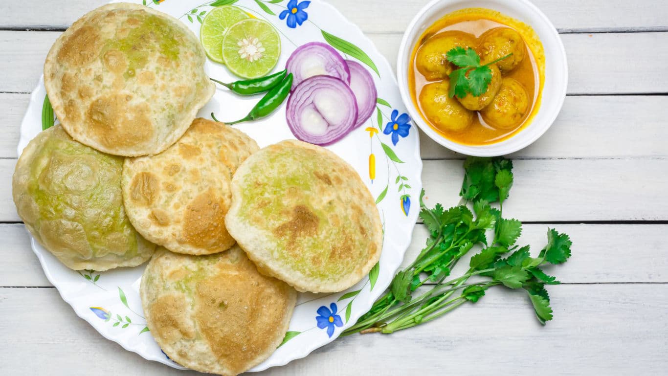Indian meal with puris and curry