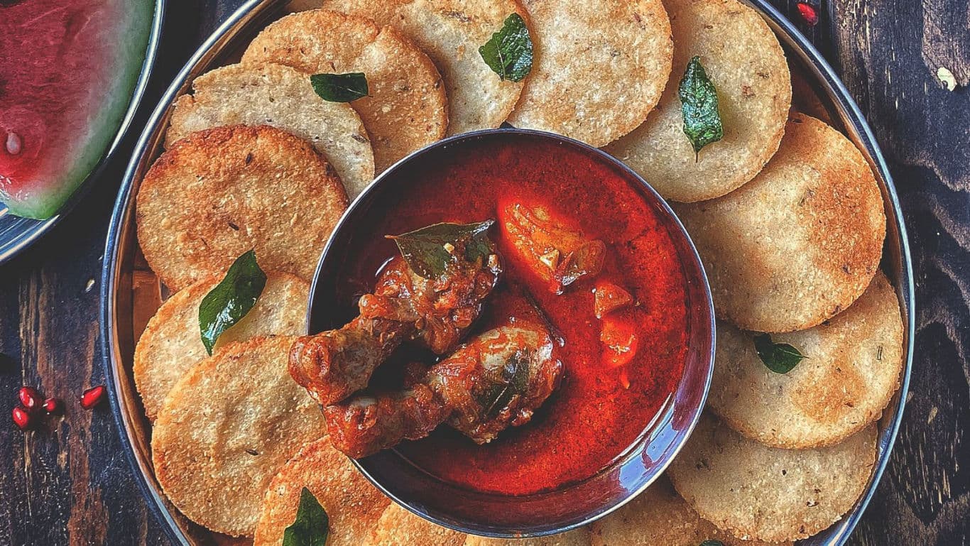 Spicy chicken curry served with fried bread