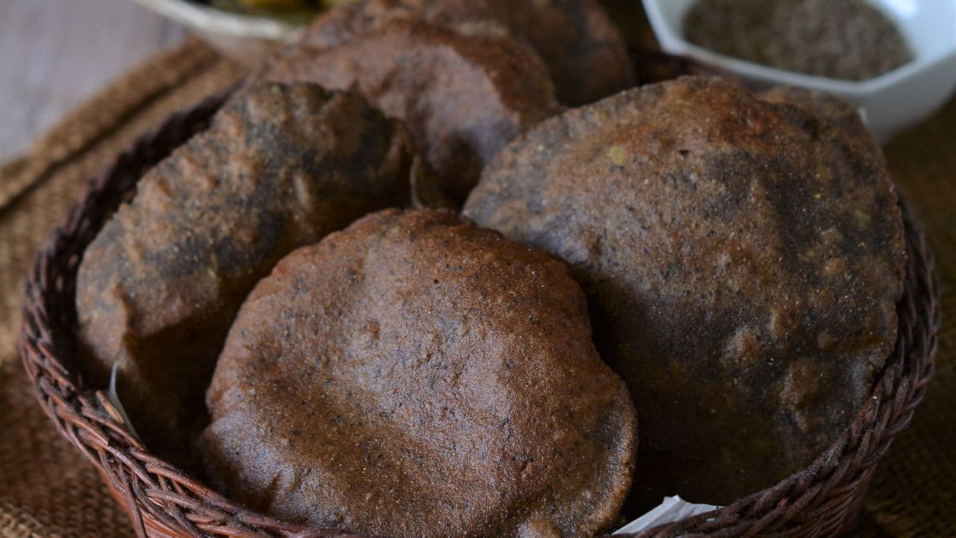 Basket of Indian Kuttu Poori on Rustic Table