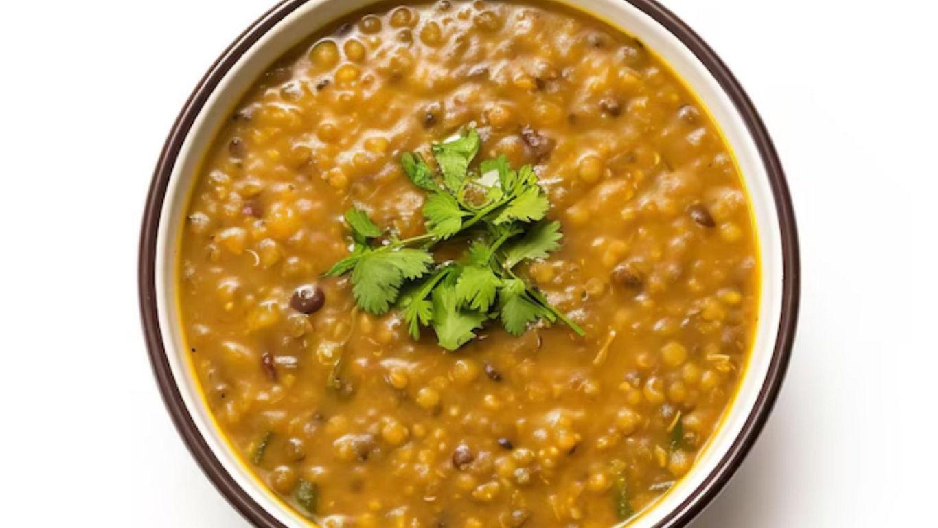 Bowl of lentil soup with cilantro garnish