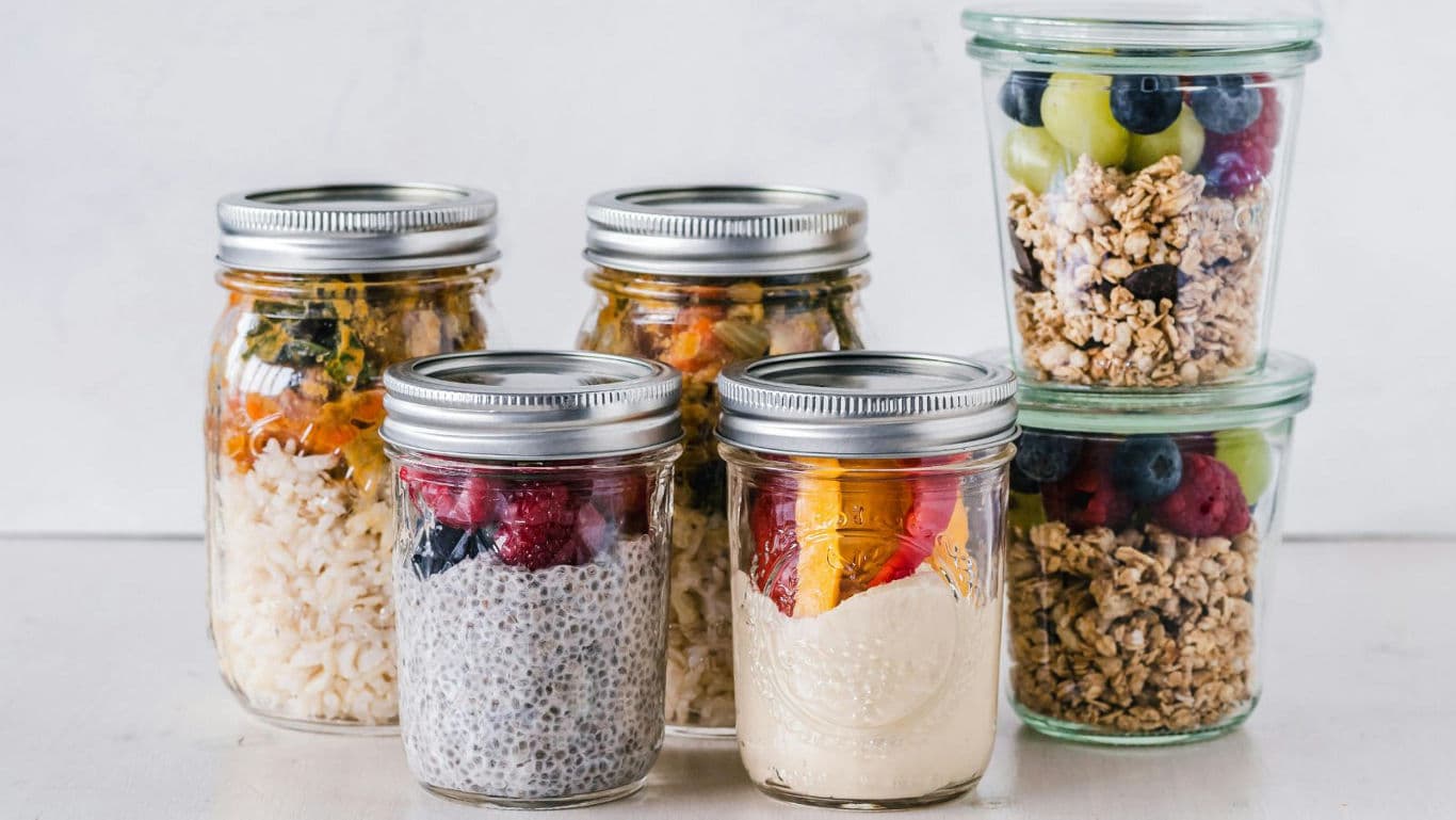 Assorted healthy meals in glass mason jars