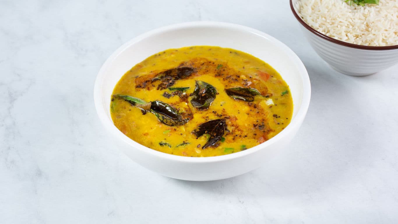Indian yellow dal tadka served with steamed rice