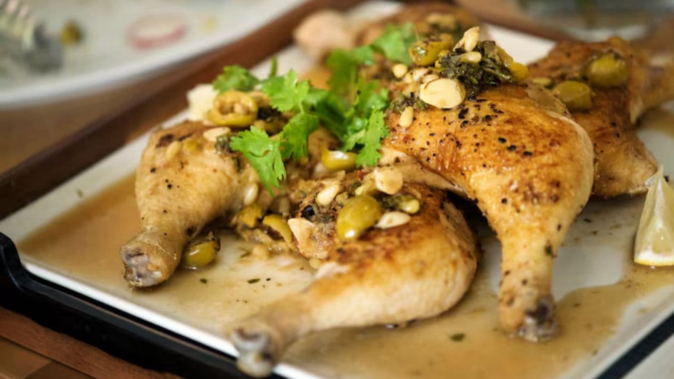 Roast Chicken Legs with Olives and Herbs on Plate