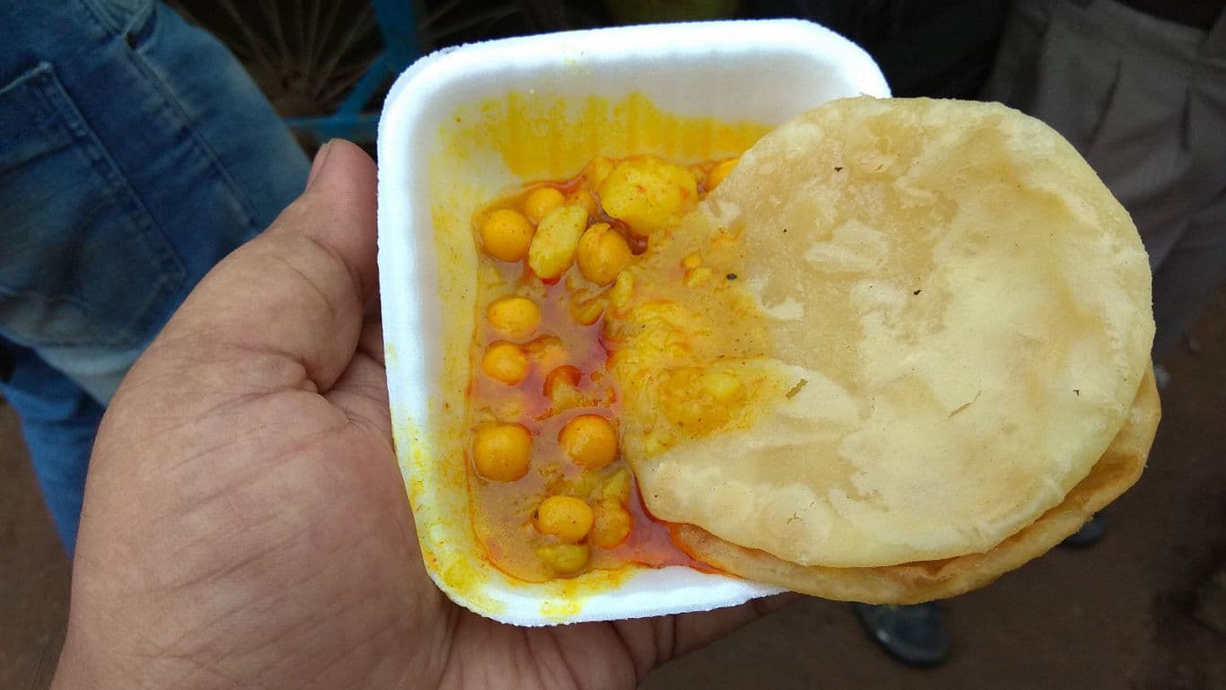 Street food plate with curry and bread