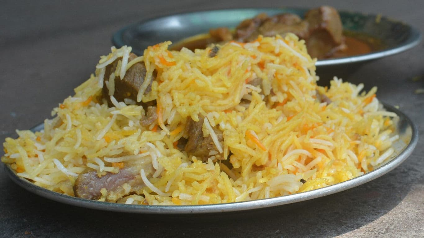 Plate of Mutton Biryani with Curry Side Dish