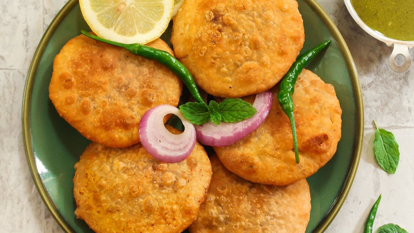 Crispy Moong Dal Kachori served on a plate with chutney.