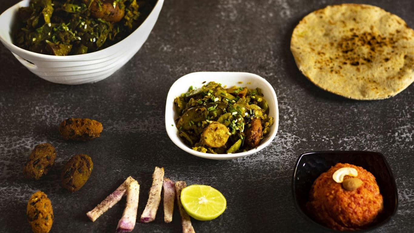 Traditional Indian meal with assorted dishes and bread