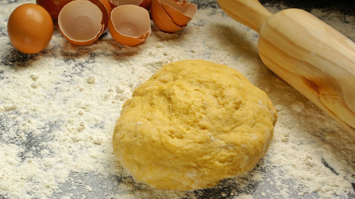 Prepared dough along with empty egg shells