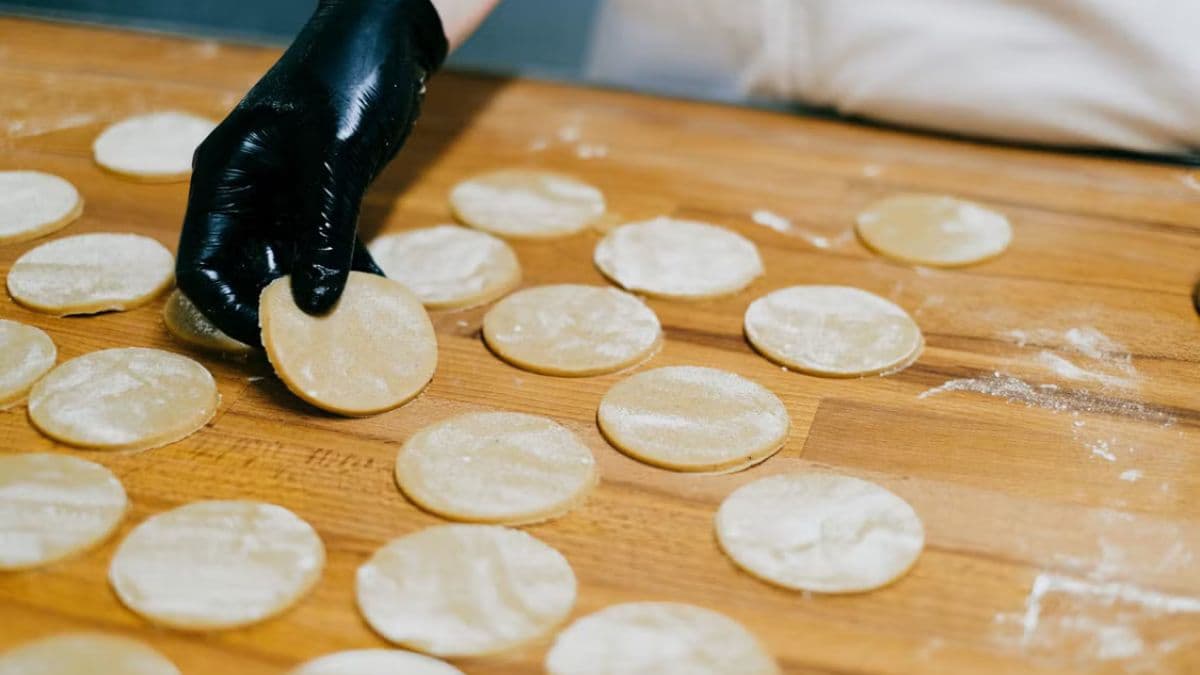 woman holding khapli atta cookies for baking