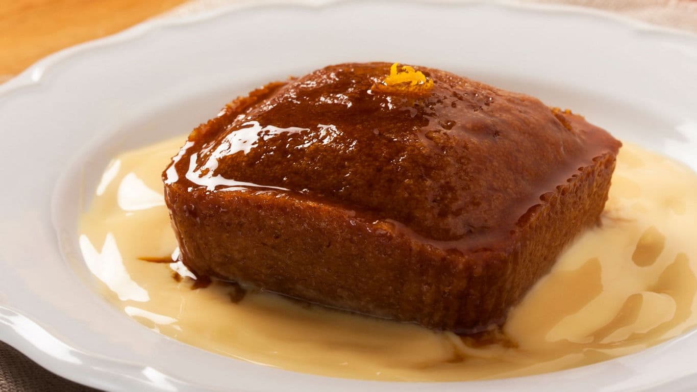 Sticky toffee pudding with caramel sauce on plate