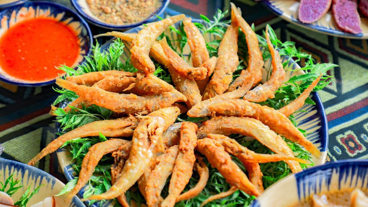 Fried fish on a bed of leaves