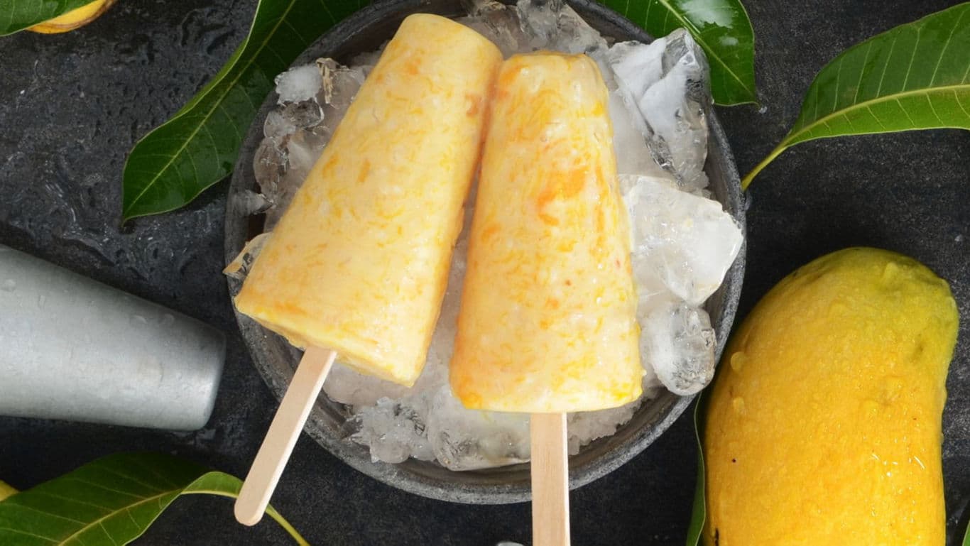 Mango ice pops on crushed ice platter