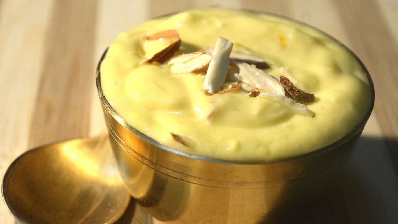 Traditional saffron dessert in brass bowl