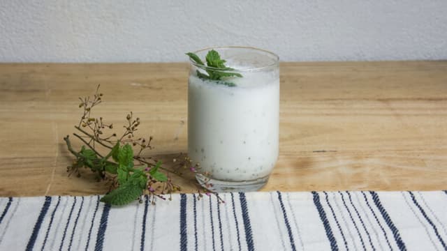 Tall glass of frothy masala chaas 