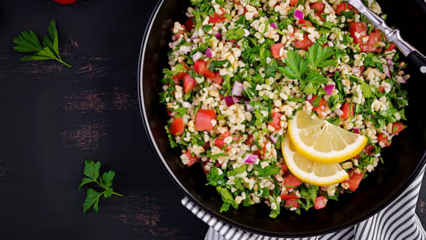 Fresh tabbouleh salad with lemon garnish