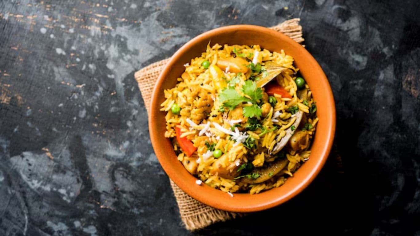 Traditional vegetable biryani served in clay bowl