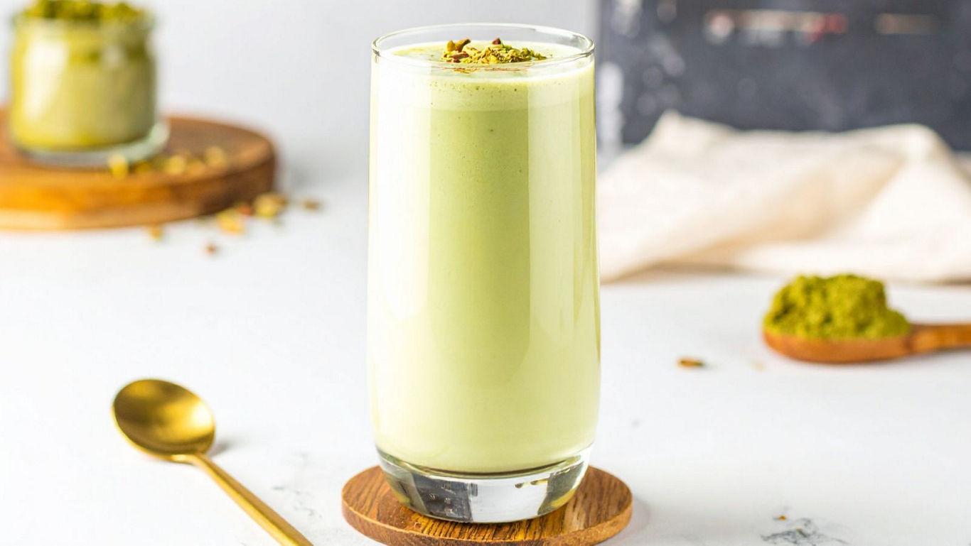 Creamy Pistachio Smoothie on Wooden Coaster