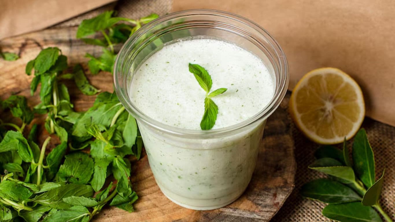 Refreshing Mint Yogurt Drink with Lemon Garnish