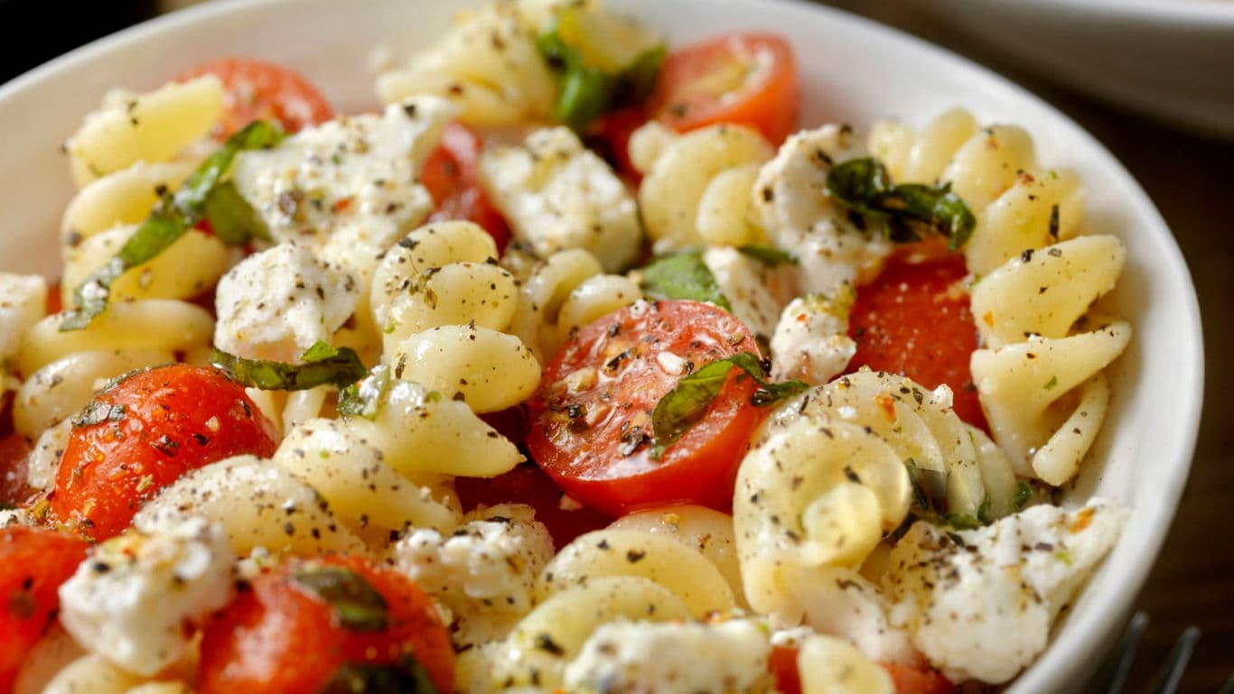 Fresh fusilli pasta salad with tomatoes