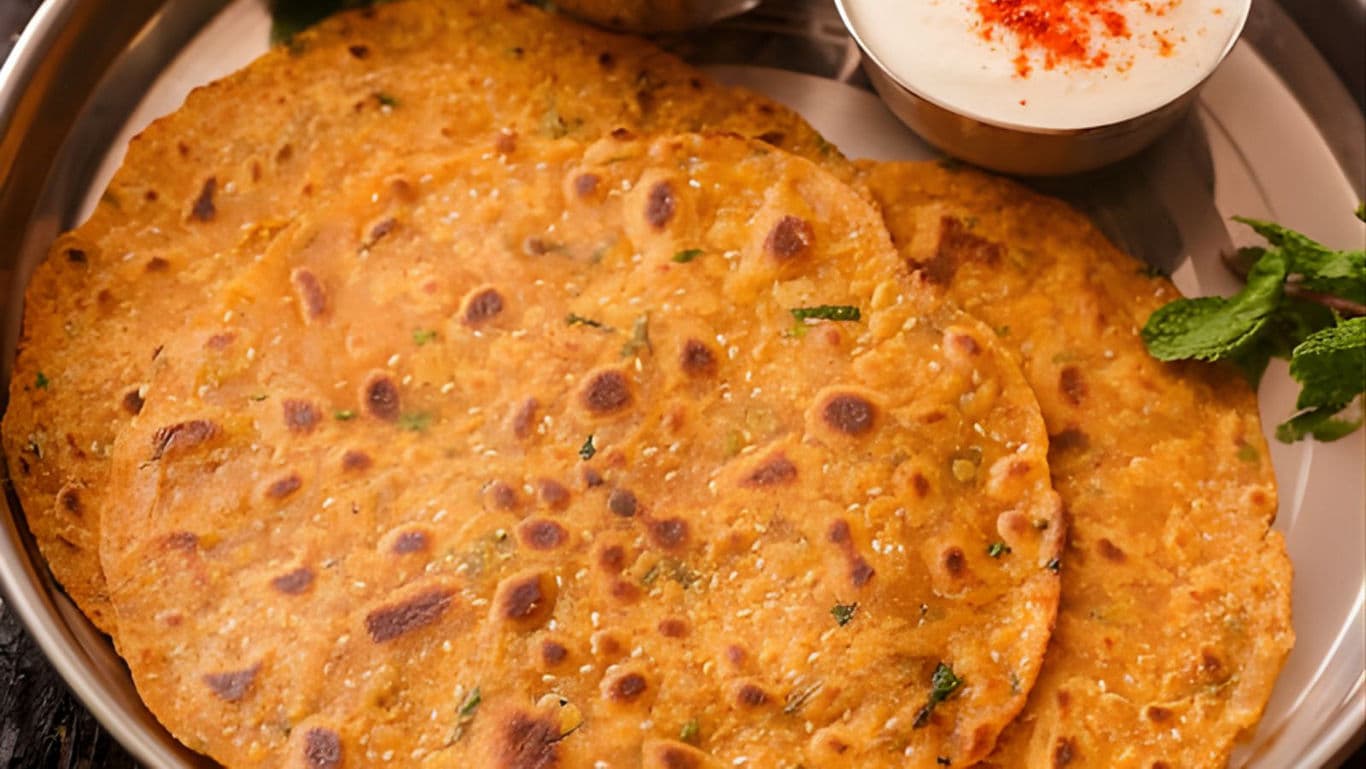 Traditional Indian thepla flatbreads with yogurt dip