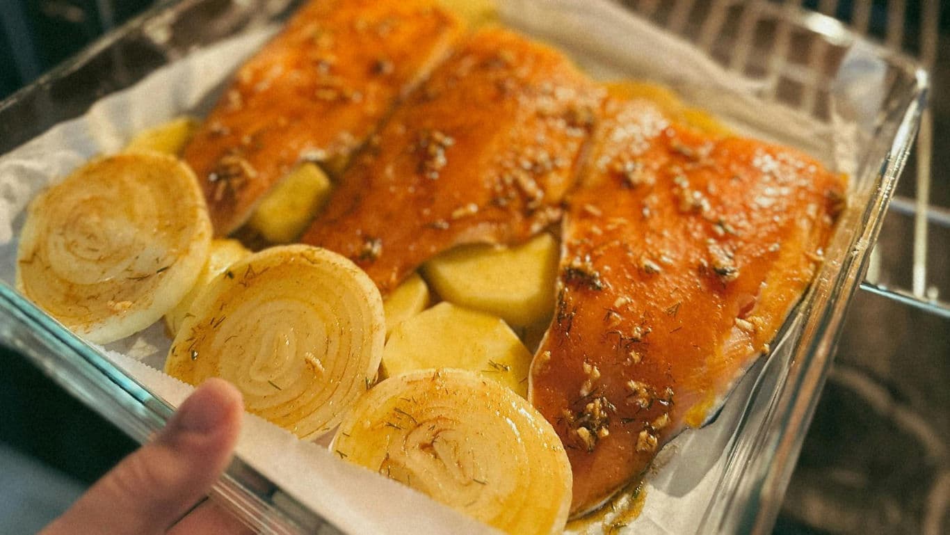 Baked salmon fillets with onions and potatoes