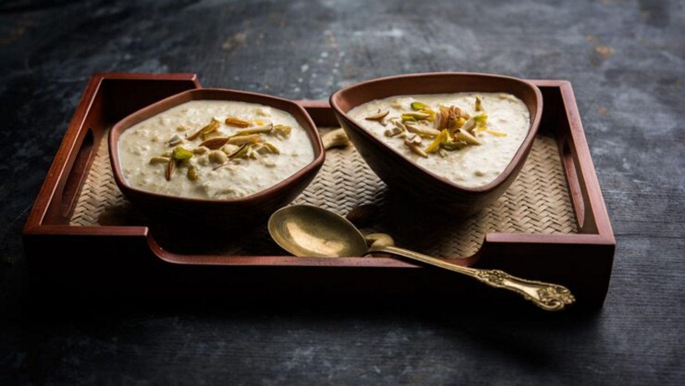 Traditional dessert bowls with golden spoon