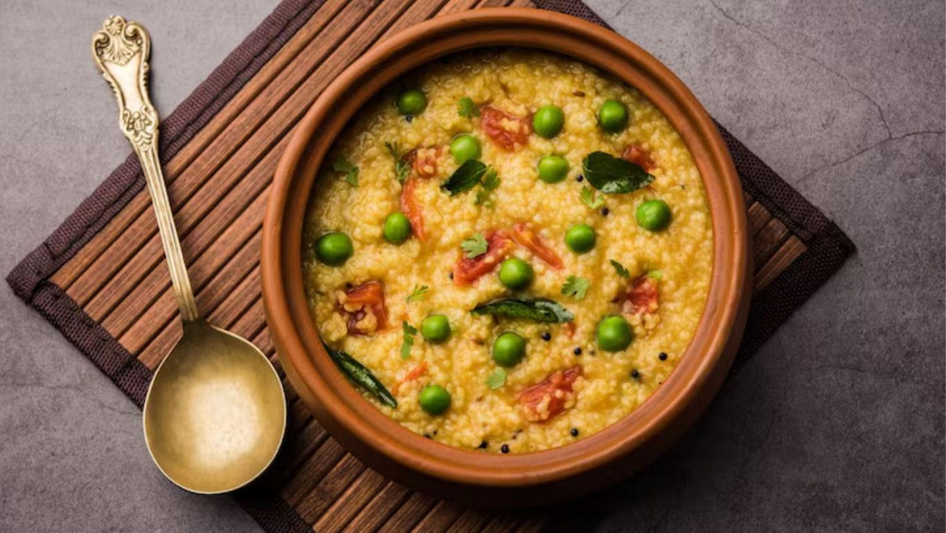 Clay bowl of millet with vegetables