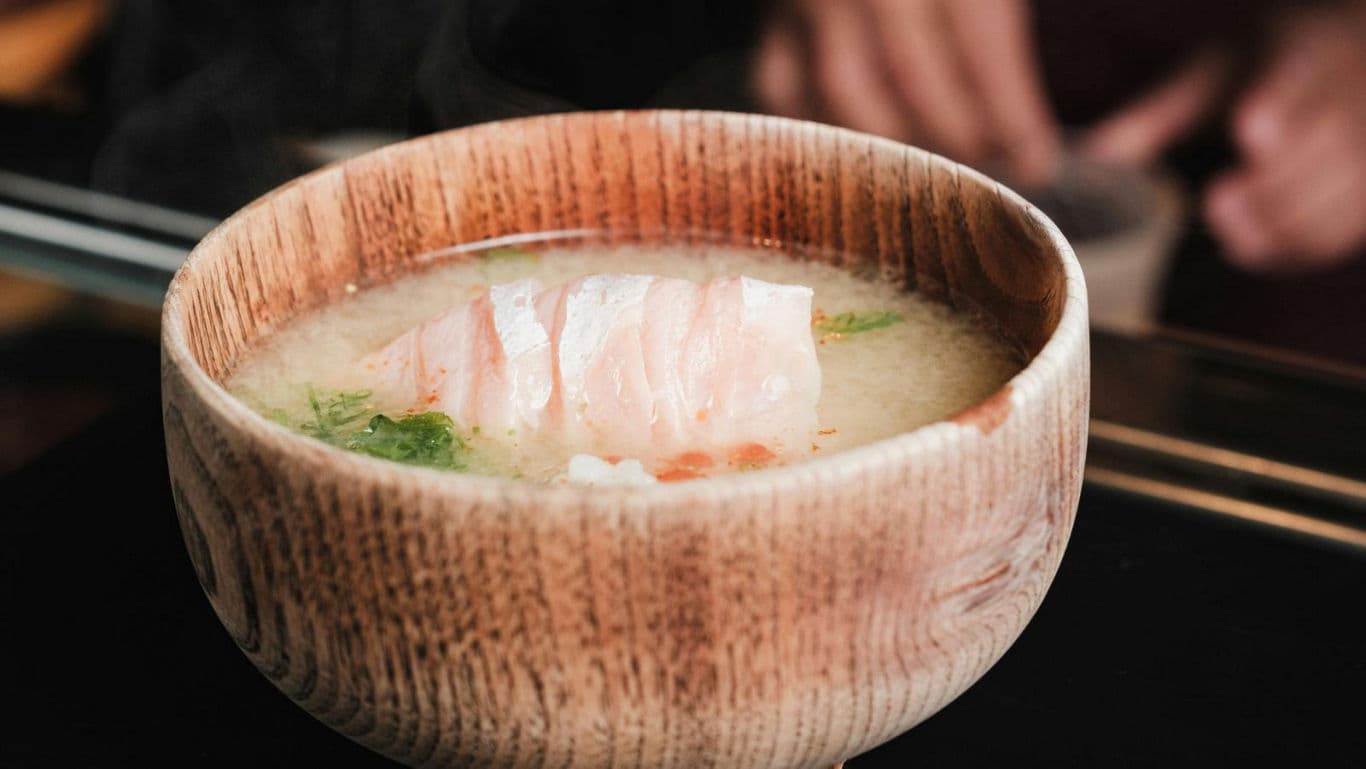 Wooden Bowl of Miso Soup with Fish Fillet