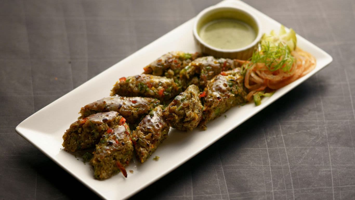 Plated herb kebabs with green chutney