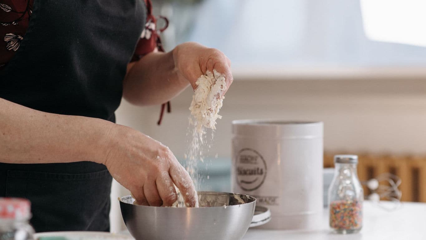 Home baker preparing dough in kitchen
