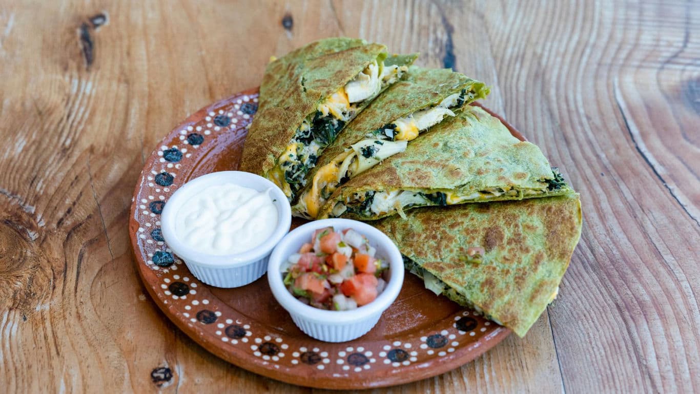 Spinach cheese quesadilla with salsa and cream