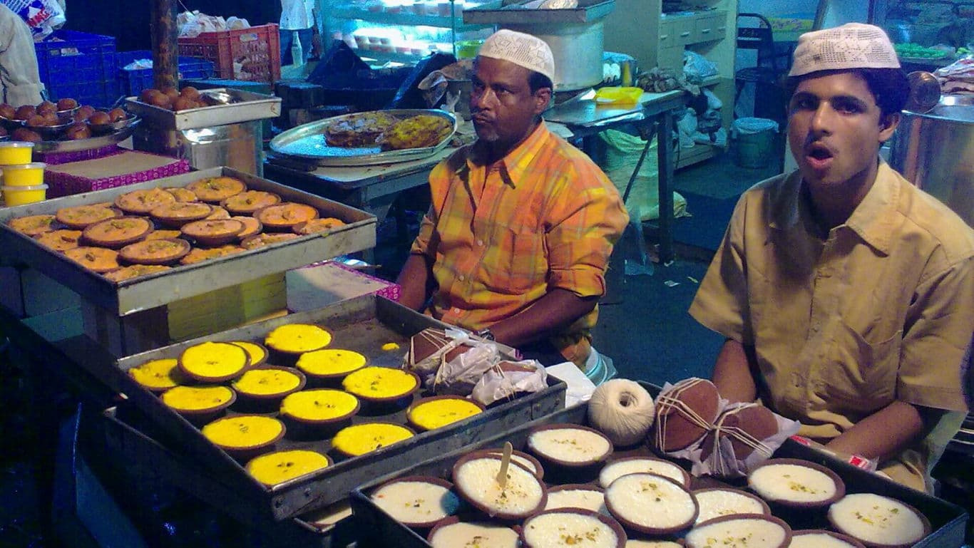 Street vendors selling traditional desserts at night market