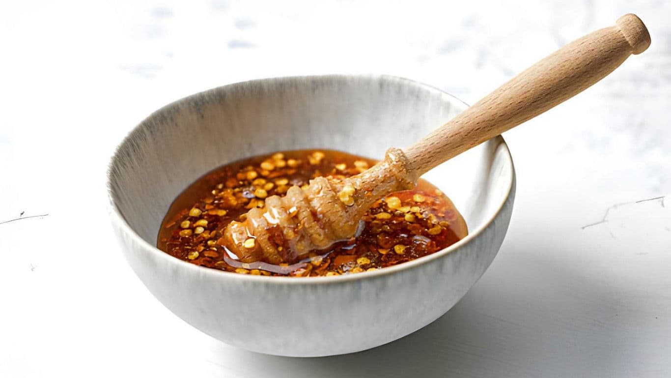Hot honey sauce in a bowl - banner image