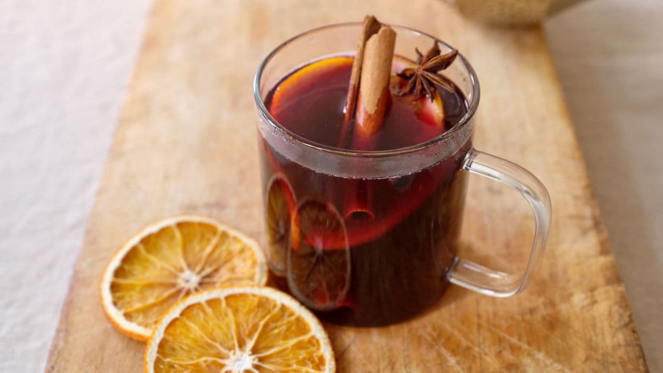 Warm spiced drink with orange slices