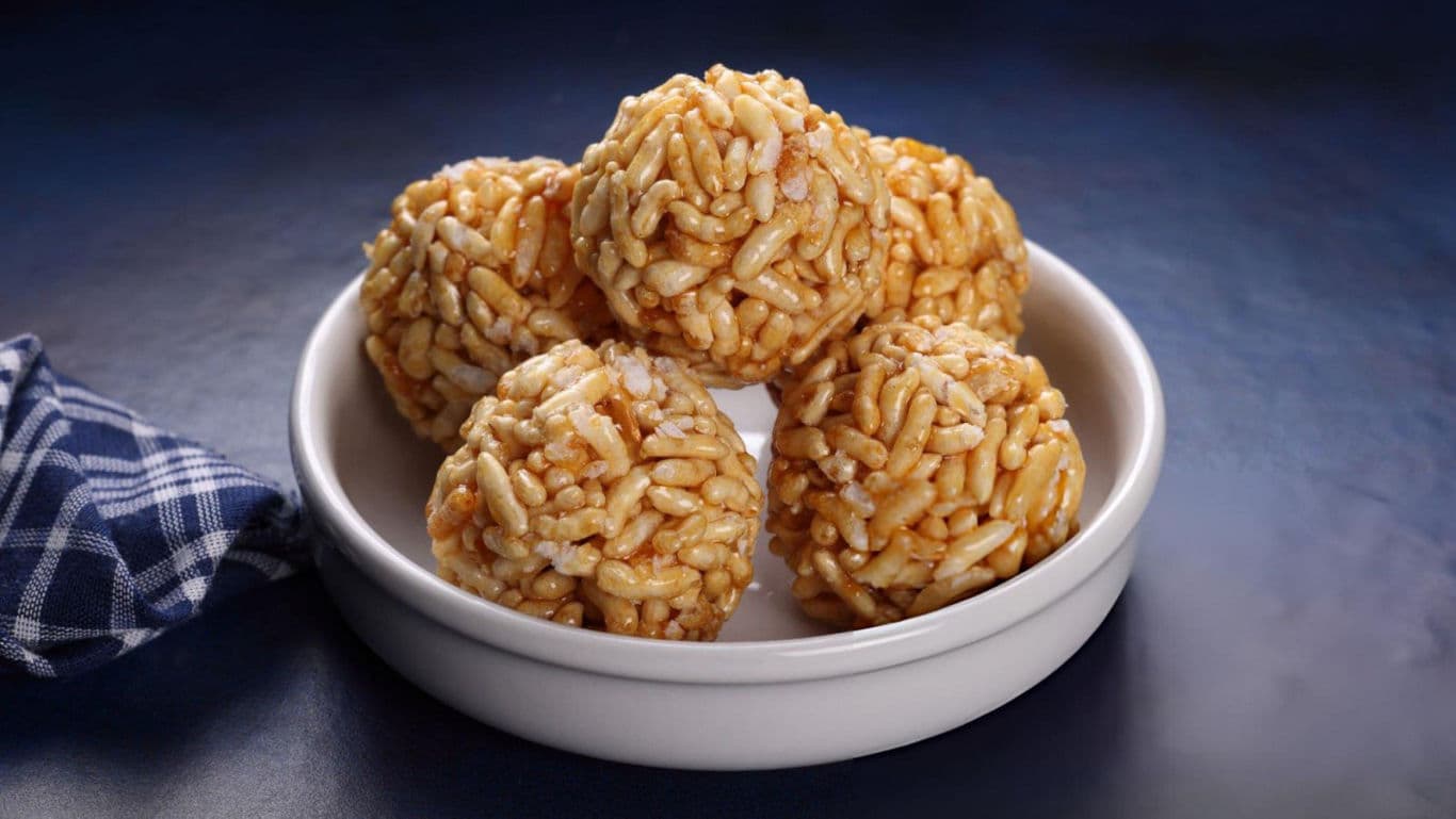 Sweet puffed rice balls in white bowl