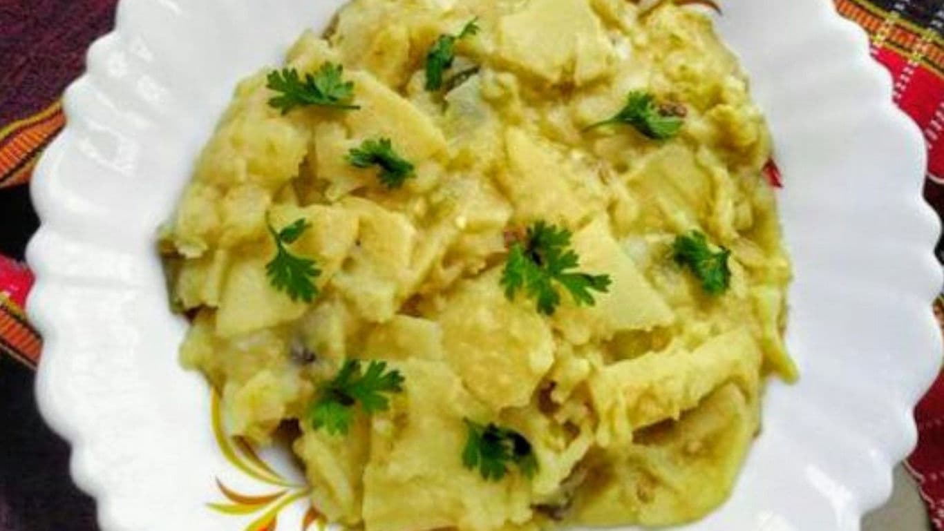 Potato curry garnished with fresh coriander leaves