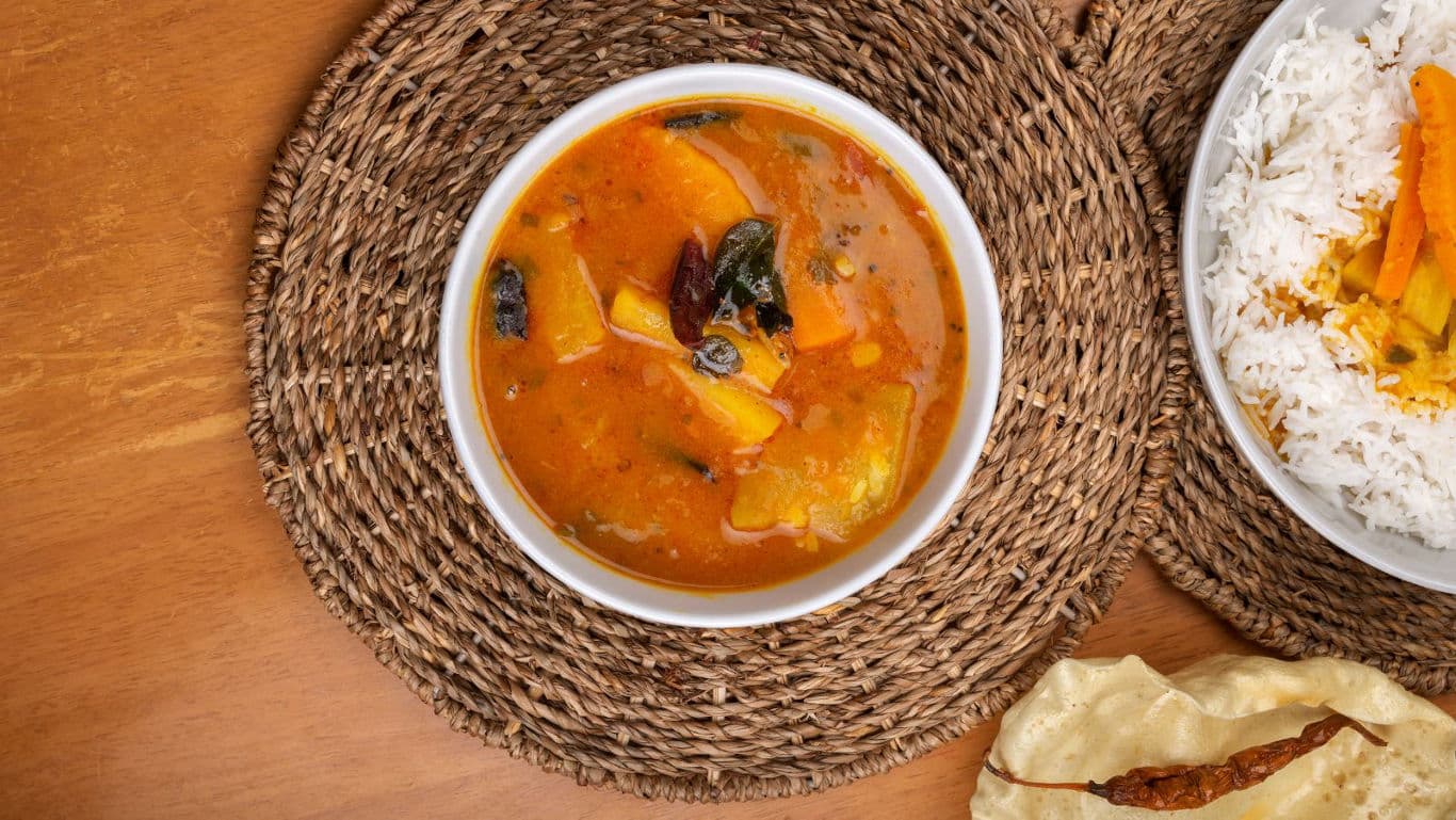 South Indian sambar with rice and papadum served