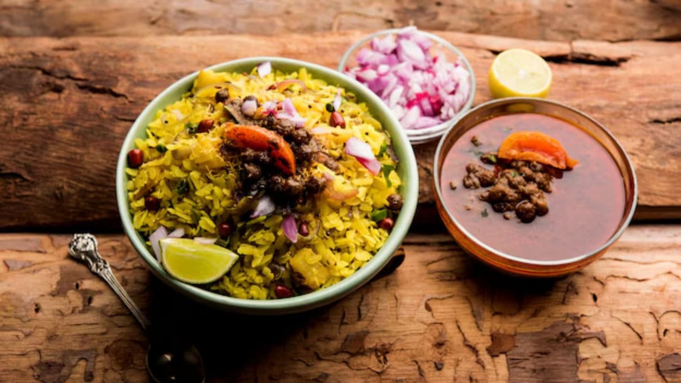 Traditional Indian Poha with Curry and Sliced Onions