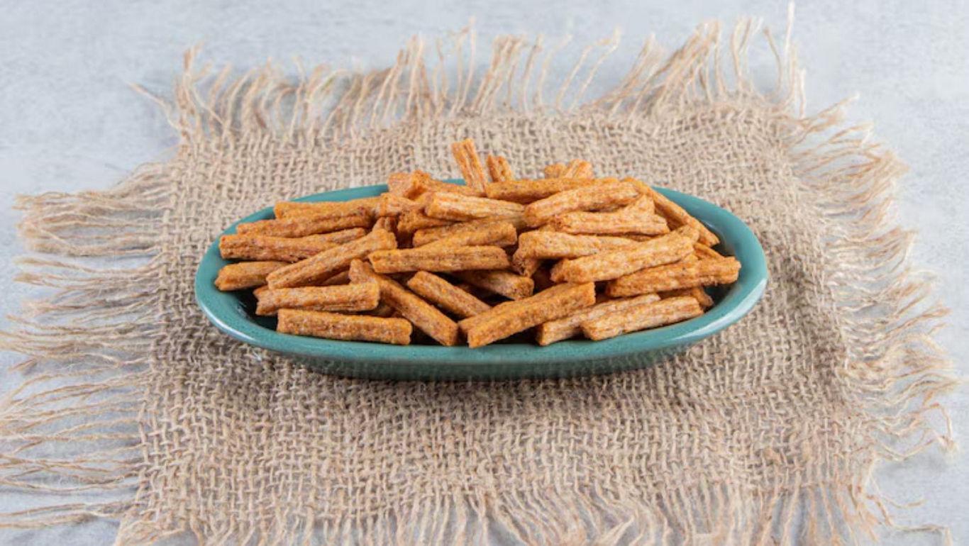 Crispy snack sticks on rustic burlap