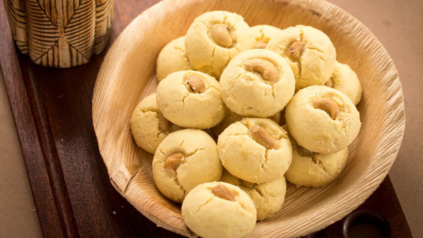 Plate of cashew cookies on wooden tray