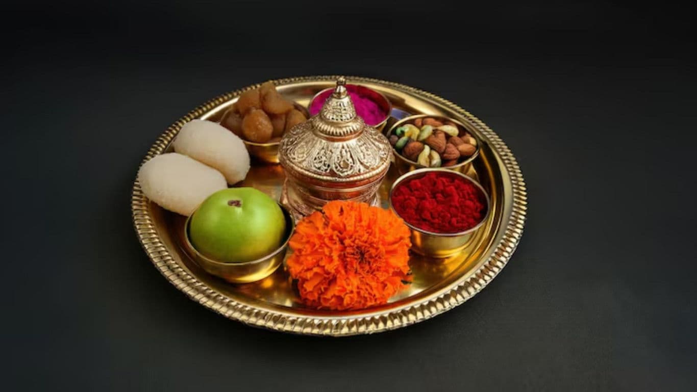 Traditional Indian pooja thali with offerings and sweets