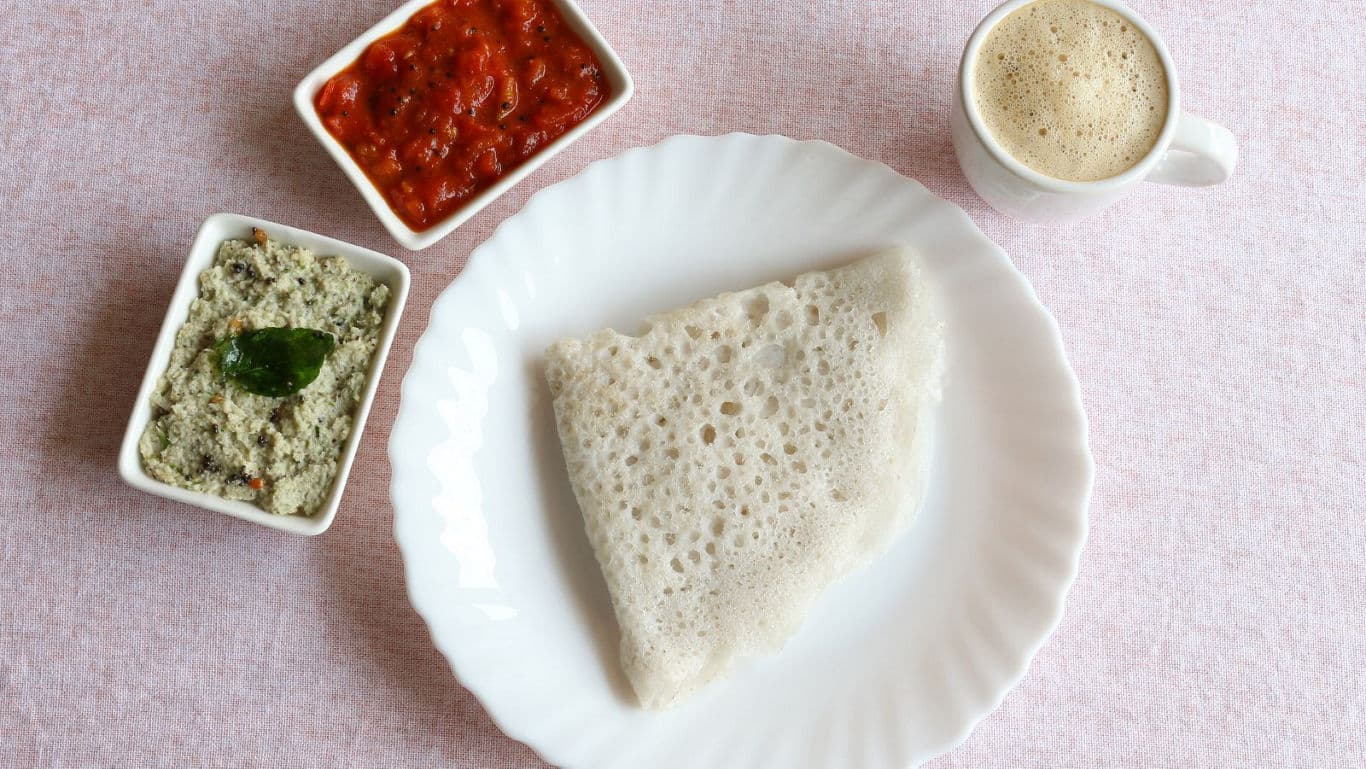 South Indian breakfast with dosa, chutneys, and coffee