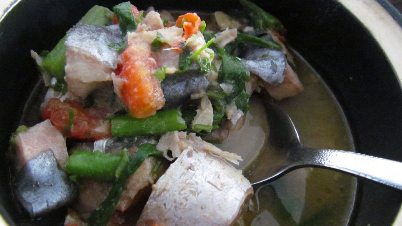 Hearty fish stew with vegetables in bowl