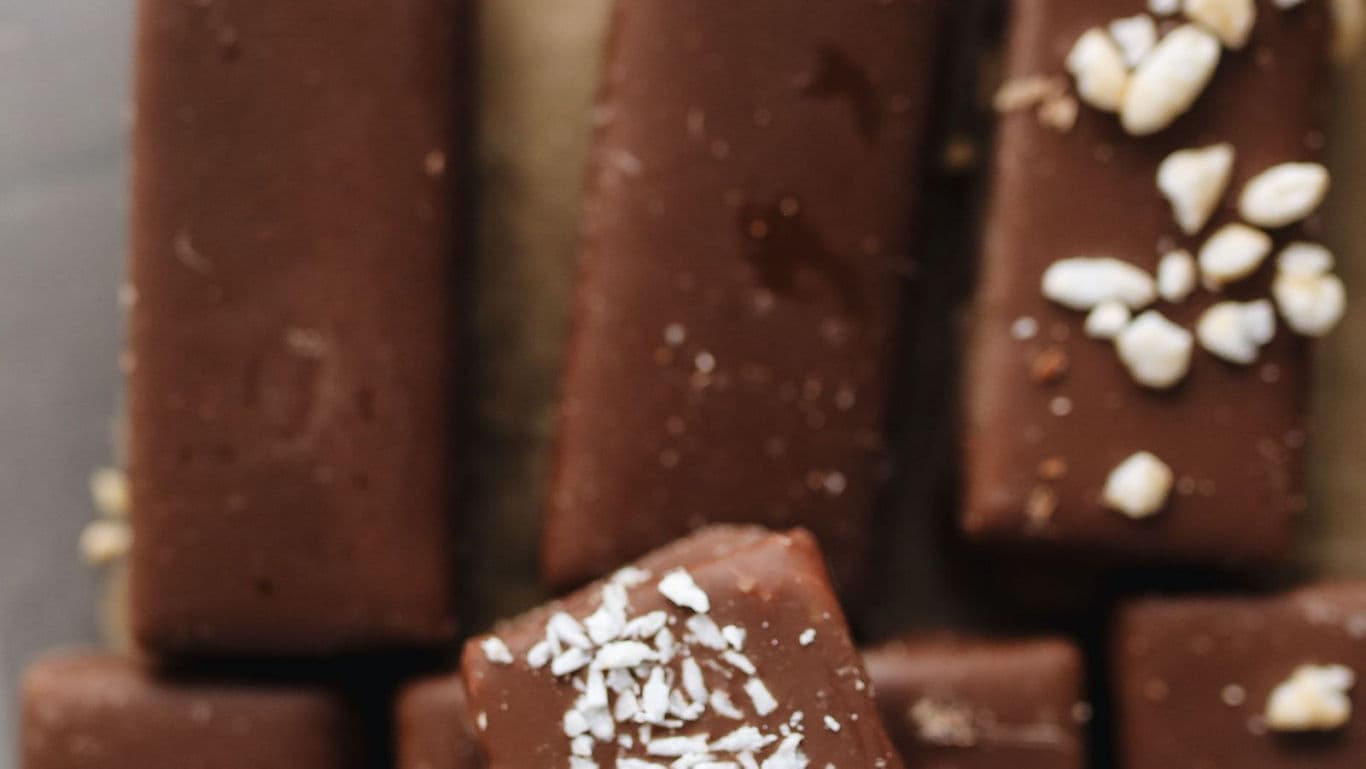 Chocolate bars topped with coconut and nuts