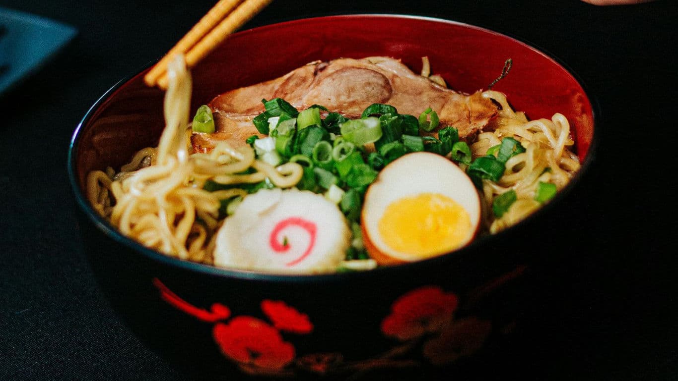Traditional Japanese ramen bowl with toppings and chopsticks