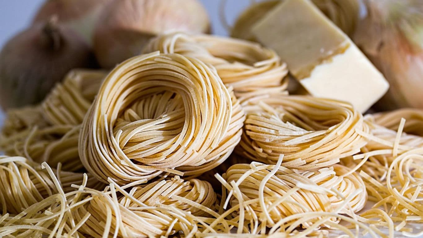 Uncooked Italian Pasta Nests with Cheese and Onions