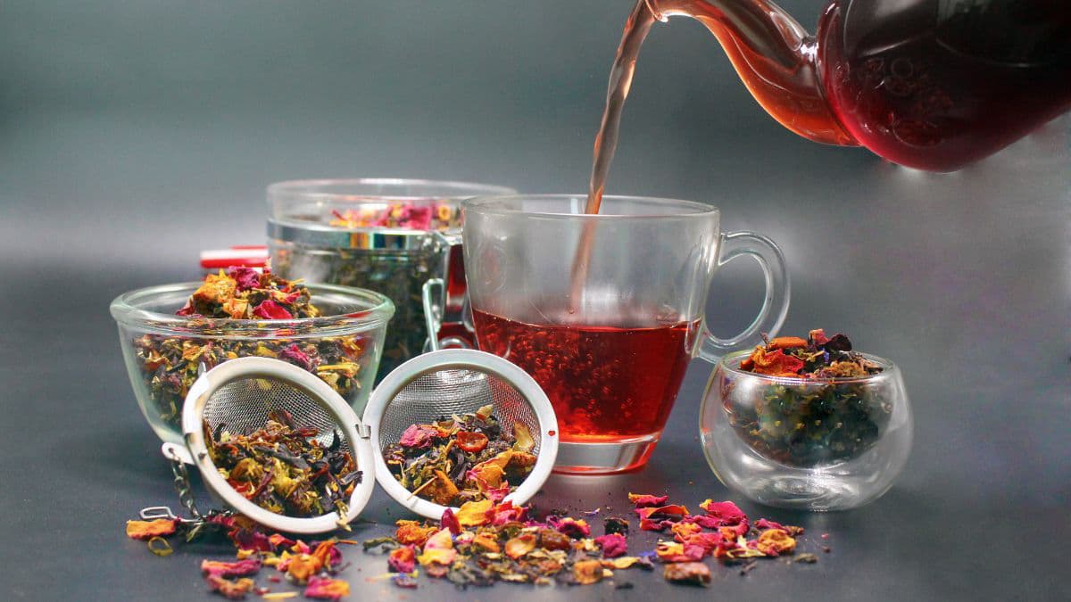 Tea being poured in a cup