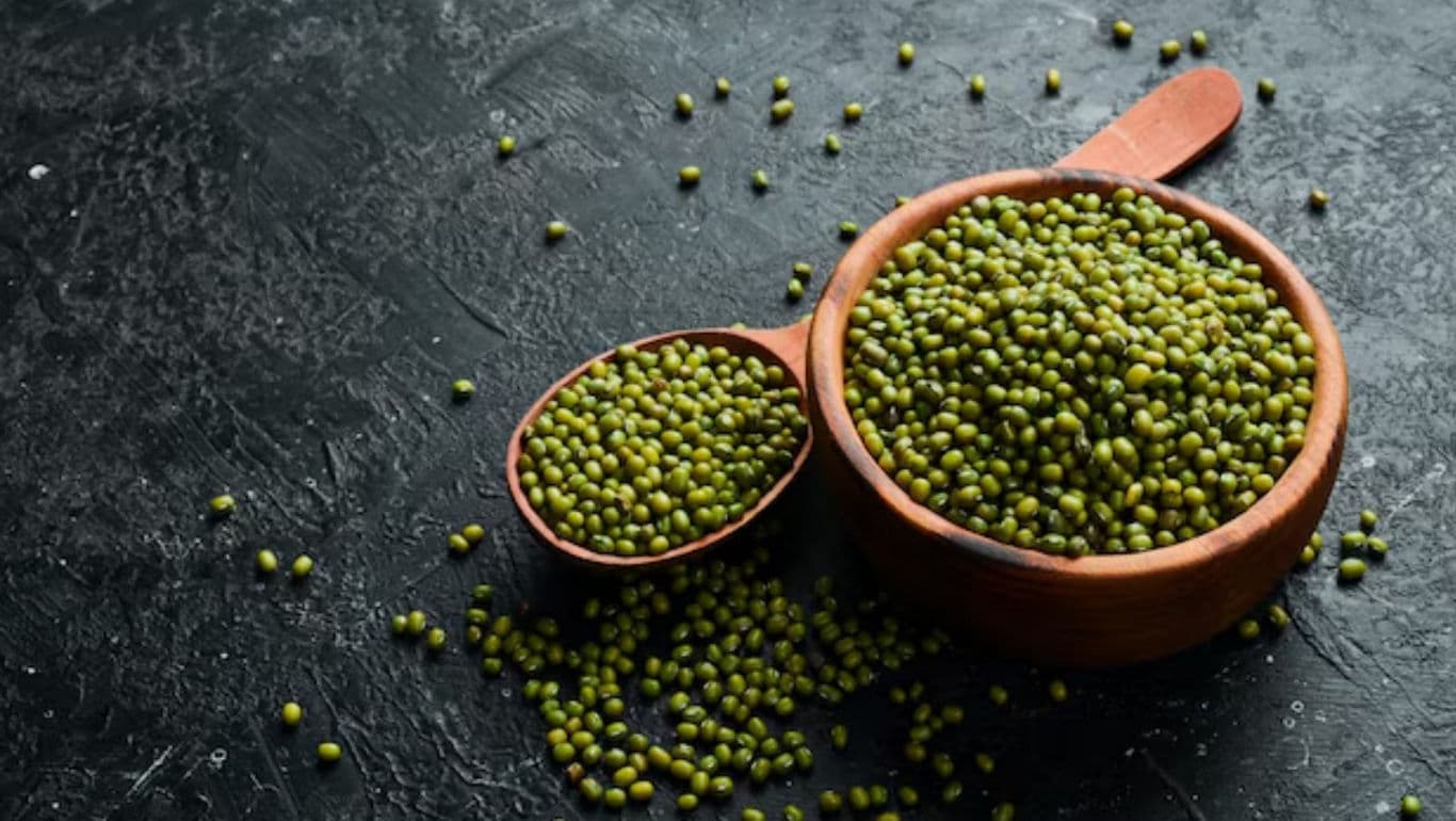 Wooden bowls filled with green mung beans