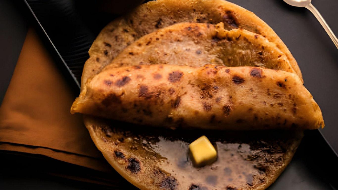 Close-up of stuffed paratha with butter