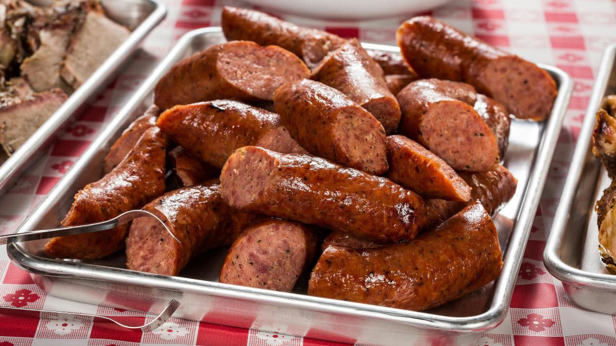 cut sausage in container
